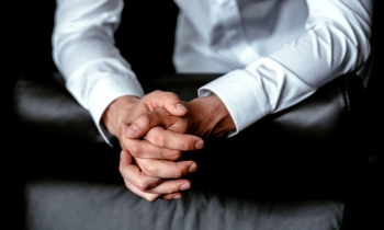 man holding hands dark